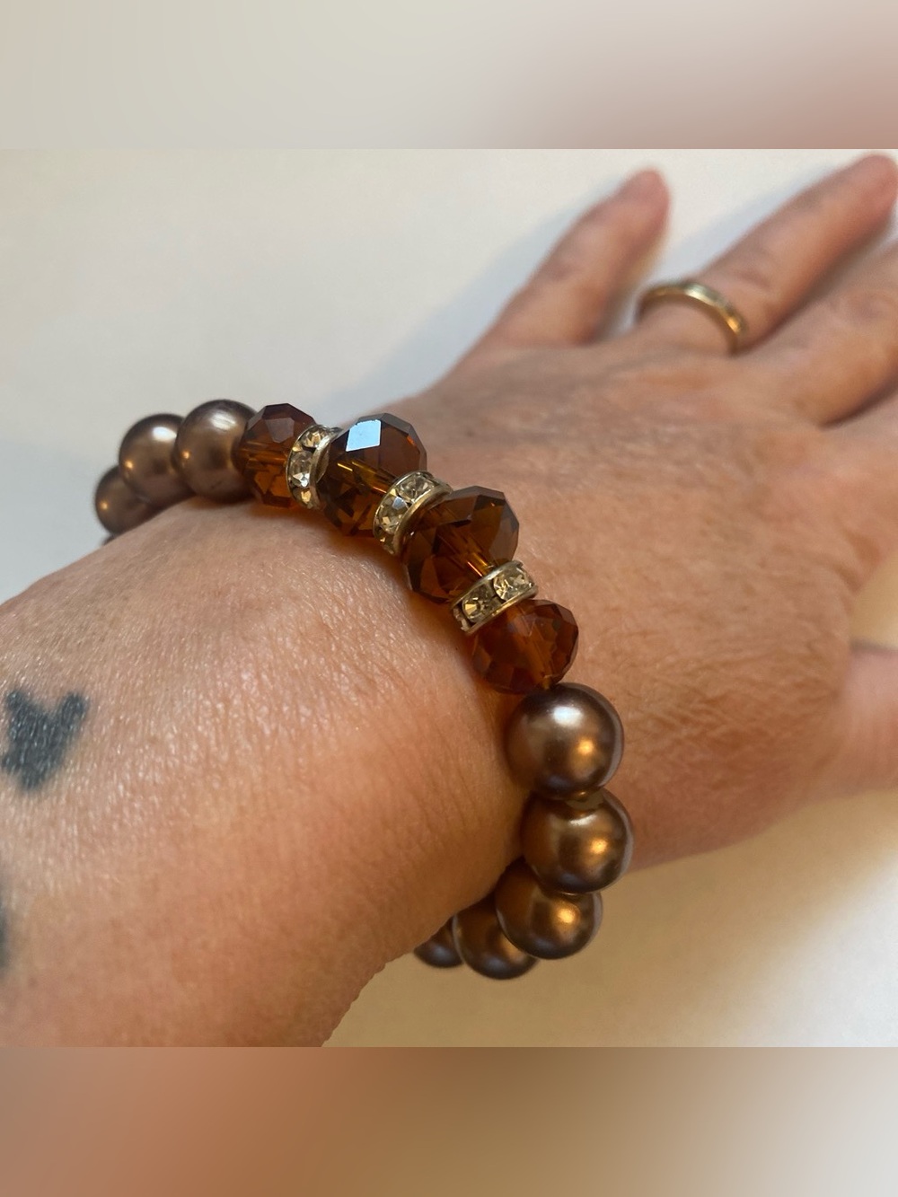Brown Glass Bead Stretch Bracelet with Faceted Amber colored Accent